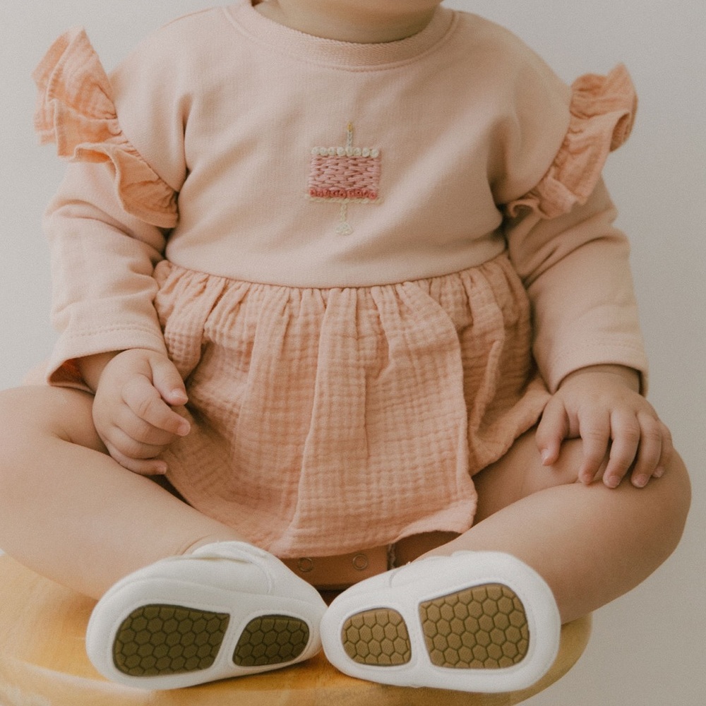 Baby romper dress. Cake embroidered